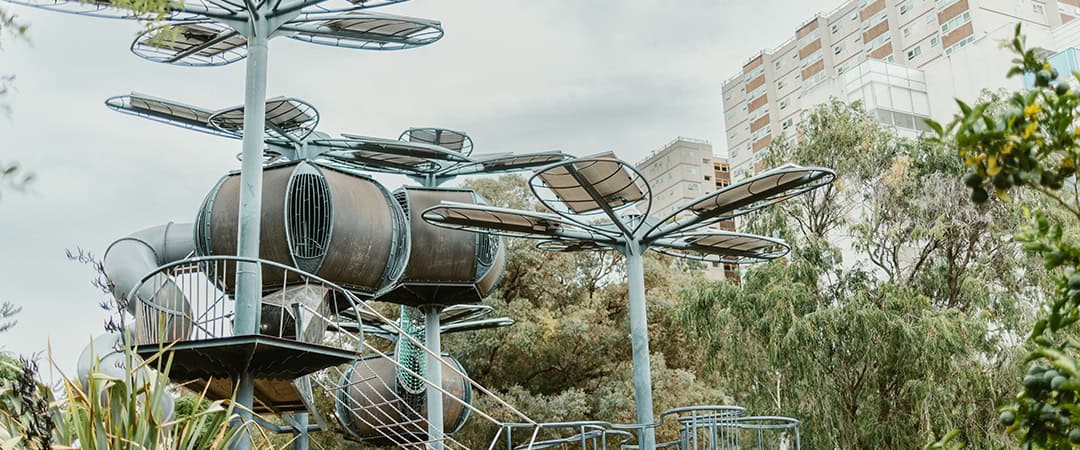 Innovative Playground at The Venny Playground with futuristic metal structures and slides at The Venny community farm.
